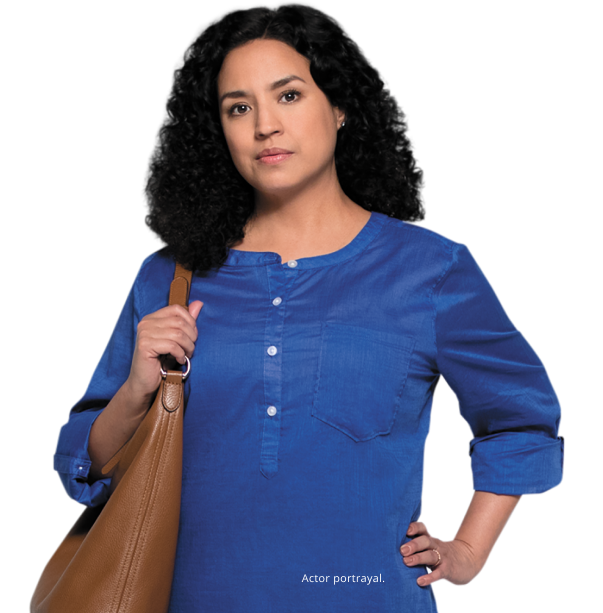 Actor portrayal of patient with black hair wearing a blue blouse and holding a brown leather purse over her shoulder